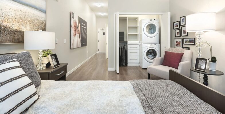 Studio suite in Westman Village featuring a spacious room with an in-suite washer and dryer.