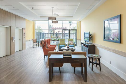Bright and welcoming memory care room with comfortable seating